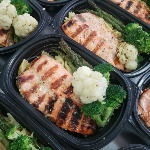 Grilled trout with pesto pasta and vegetables