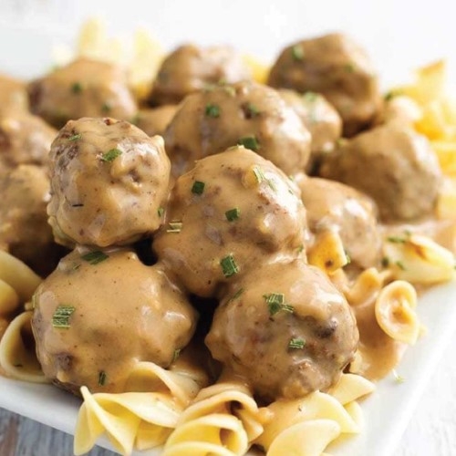 Swedish meatballs with egg noodles and vegetables.